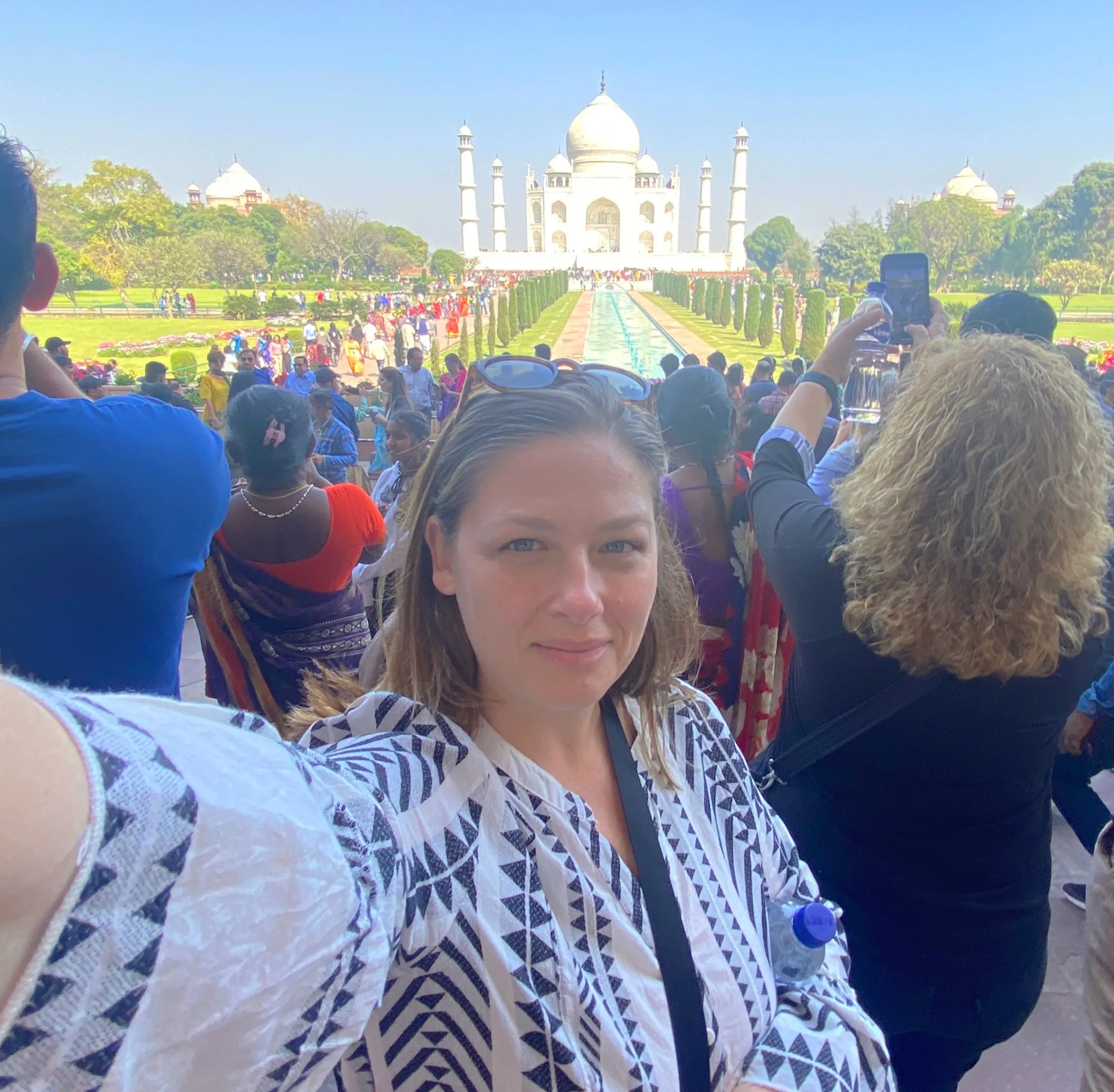 Water.org employee Andrea Shores smiling in front of the Taj Mahal.