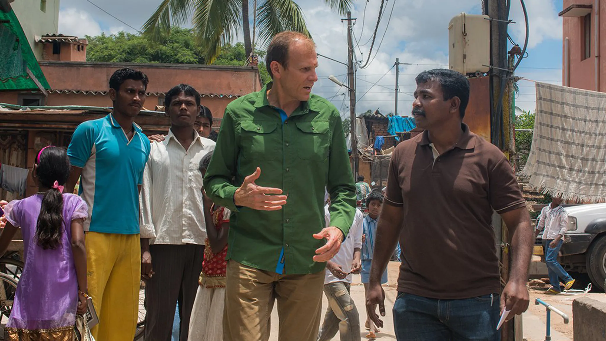 Gary White speaking to a man in India.